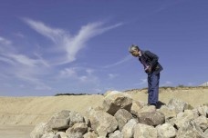 Lee Ufan hunting for stones, East Hampton, New York, October 2010<br />Photo: David Heald  [Solomon R. Guggenheim Foundation]