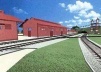 À esquerda, armazém que abriga o museu ferroviário. Ao fundo, podemos observar o elevador de passageiros, a ser construído, que interligará a praça do Mirante II ao pátio da EFM-M. Orientação: A direita, desta imagem, está o Rio Madeira; a esquerda, o cen