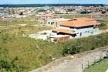 Imagem do Condomínio Jardins do Lago, uma ocupação irregular de classe média conduzida ousadamente em área de proteção ambiental nas proximidades do Lago Paranoá, iniciado no final da década de 1980. Foto de 1995.   [Acervo da urbanista Cecília Juno Malagutti]