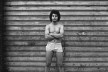 Rapaz descalço na porta da garagem, São Paulo SP, 1975<br />Foto Cristiano Mascaro 