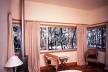 The bedroom with the view of the trees is on the upper level
