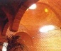  Unión de dos cúpulas bizantinas con columna hacia arriba a tracción. En su unión las directrices son dos ángulos comerciales de 2”x2”x1/8” pegados de espalda. Y en este caso recubiertos con ladrillo. Clínica Popular en La Villa, D. F. 1992 y 1998