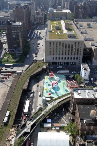 Rainbow City presented by AOL, an environmental and interactive art installation by FriendsWithYou, on view from June to early July at The Lot, a temporary public plaza below the High Line at West 30th Street, looking East.   ©Friends of the High Line, 20