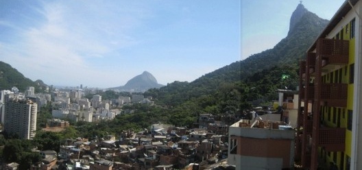 View from the favela (slum) Santa Marta, with formal city in the lower areas. Christ the Redeemer in the right side. The city has high contrasts of forests and dense urbanized areas<br />Foto Cecilia Herzog 